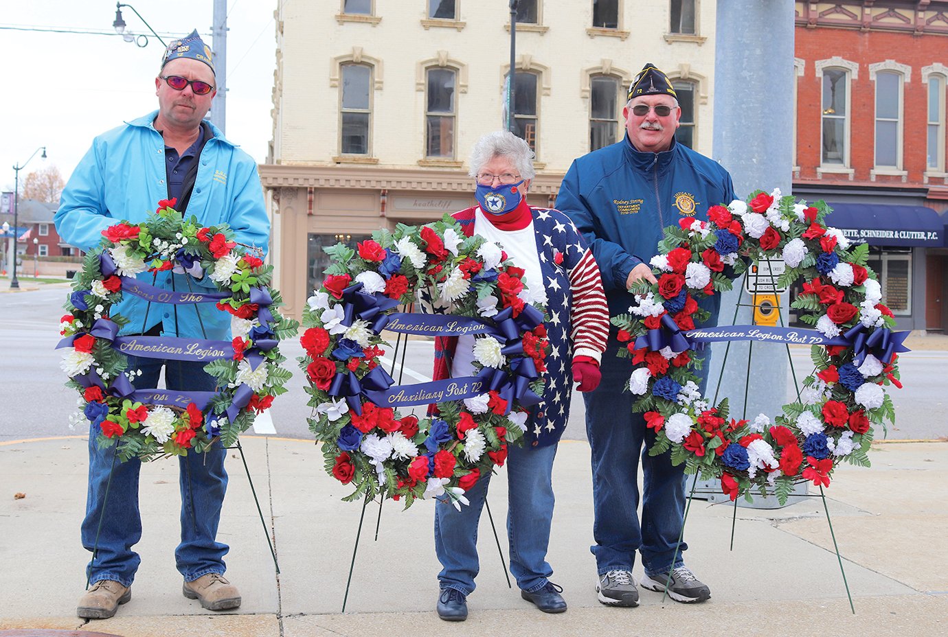 Sons of the American Legion President Keith Switzer, from left, Legion Auxiliary President Rosemary Hutchison and Legion Post 72 Commander Rodney Strong prepare to place ceremonial wreaths on the city's Soldier's and Sailor's Monument on Veterans Day.